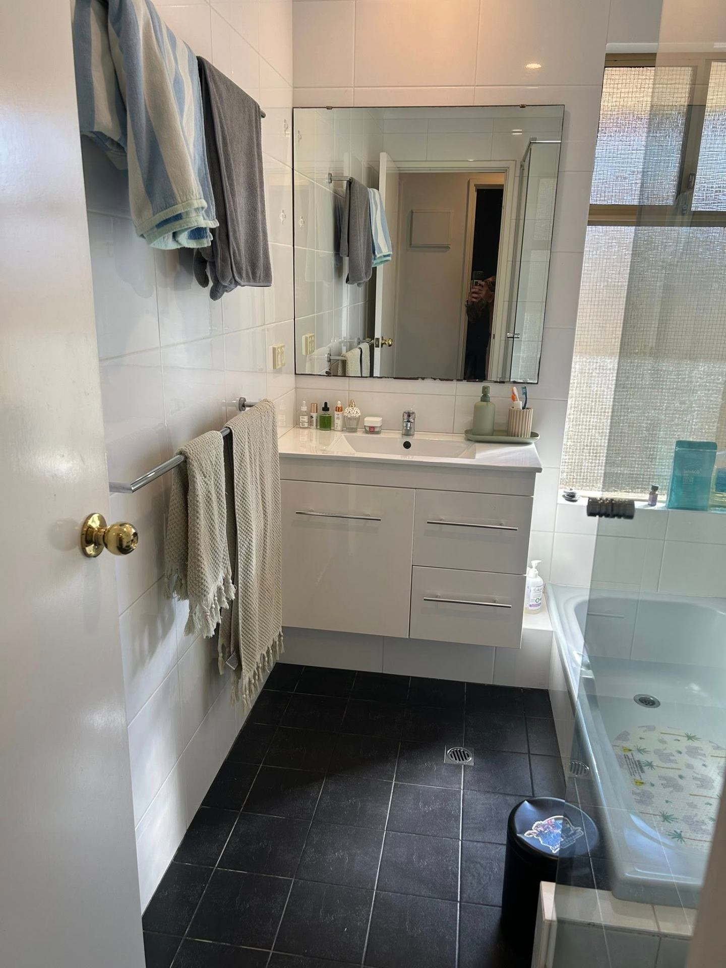 After photo — Family bathroom in Safety Bay — vanity, mirror, floors, and bath cleared and freshened up. in Rockingham