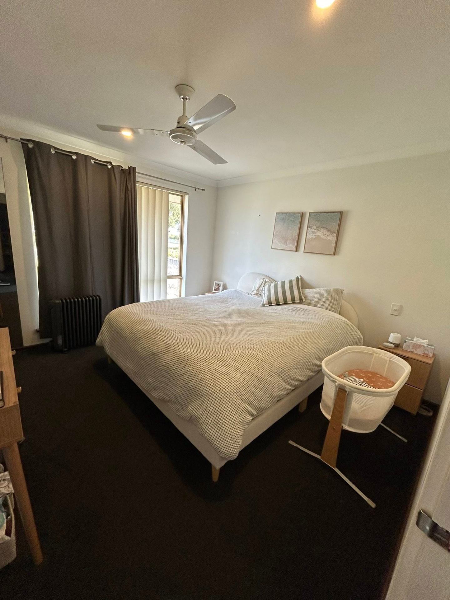 After photo — Main bedroom turnover — bed remade, surfaces cleared, floors vacuumed ready for the next stay. in Rockingham