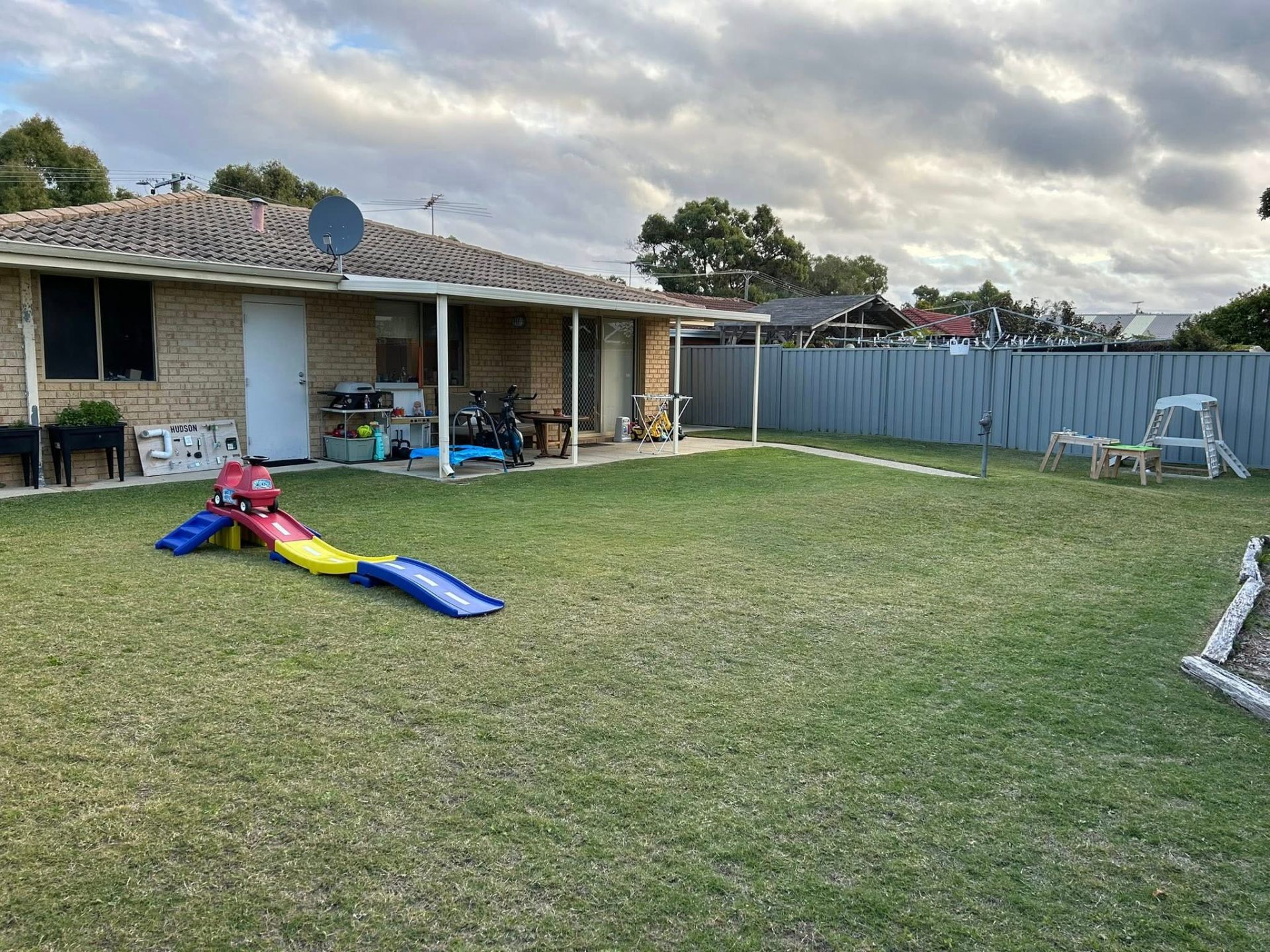 After photo — Backyard tidy in Rockingham — toys put away, lawn mowed, edges and paths cleared down. in Rockingham