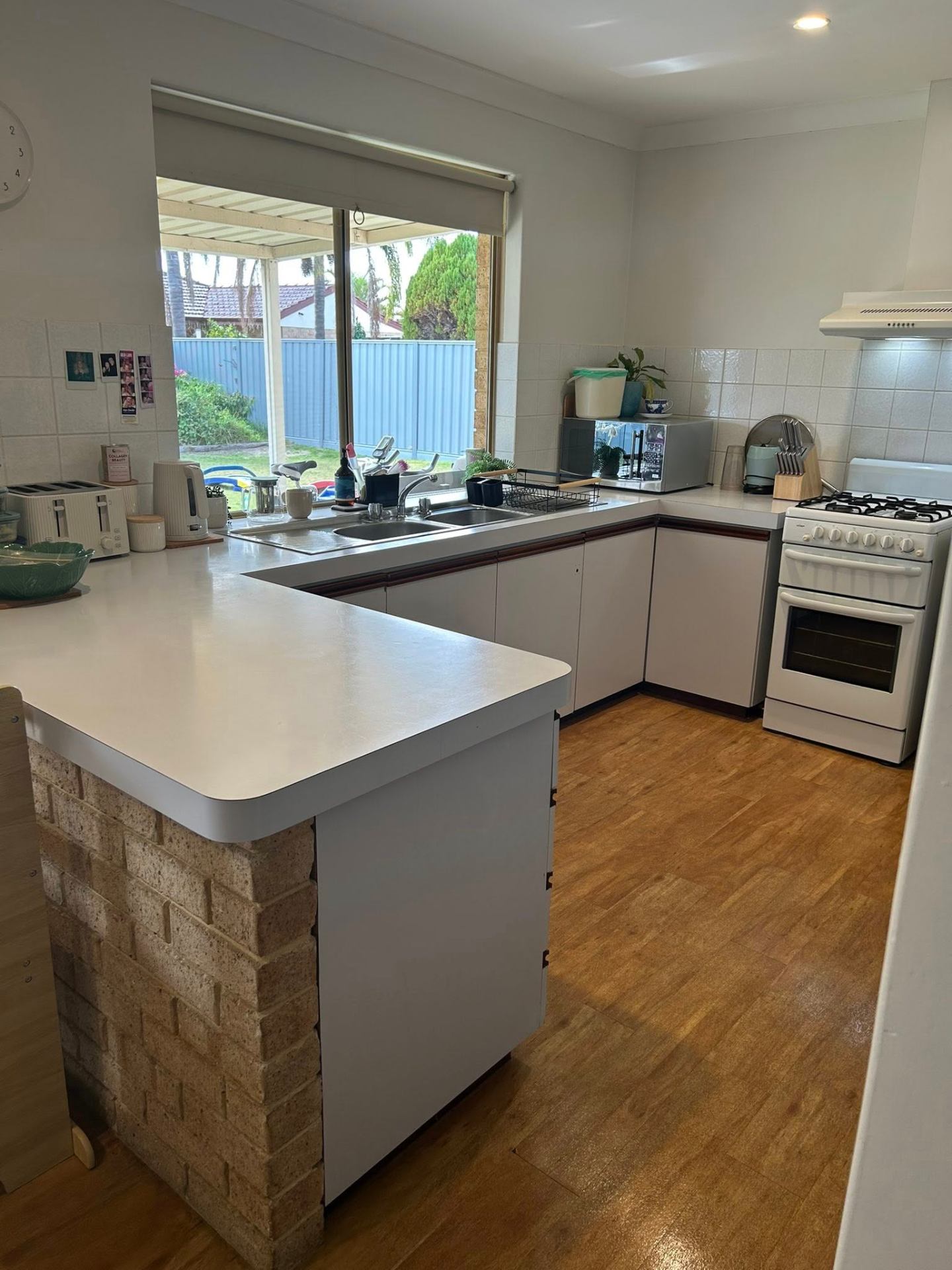 After photo — Kitchen reset in a Rockingham family home — benches, sink, and stovetop area cleared and wiped down. in Rockingham