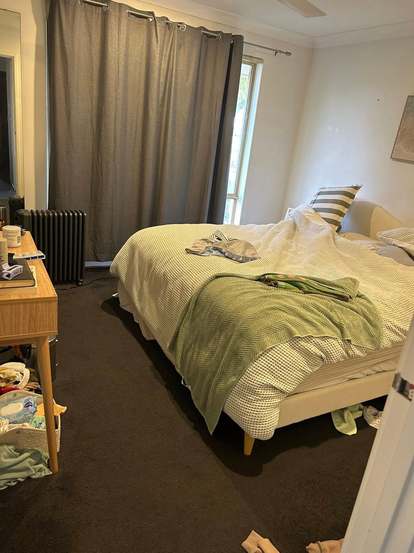 Before photo — Main bedroom turnover — bed remade, surfaces cleared, floors vacuumed ready for the next stay. in Rockingham